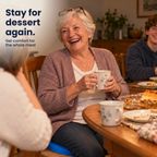 Smiling grandmother at the family dinner table with a cup of tea, sitting on the blue honeycomb gel cushion. Text: Stay for dessert again.
